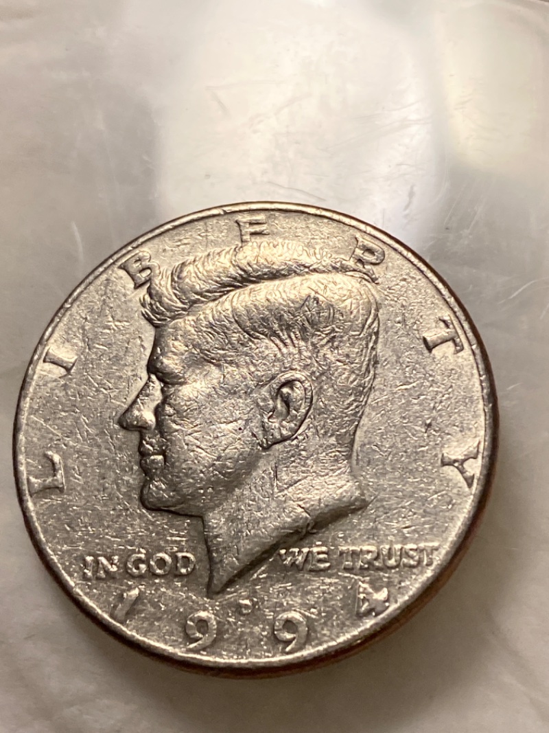Couple-Coins-That-Are-Misaligned-Off-Center-Strike